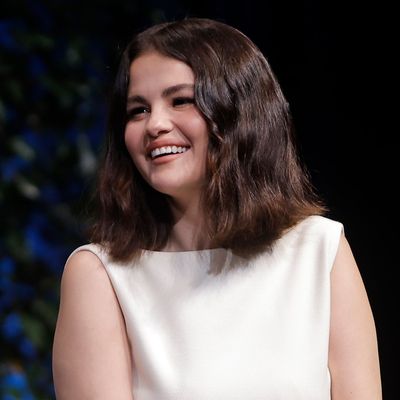 Selena Gomez Extends Her Little White Dress Streak in a Dôen Midi and Mary Janes