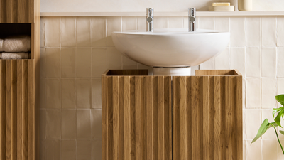 This New Bathroom Storage From Habitat Fits Around Your Existing Pedestal Sink, but Will Make It Look 100 Times More Expensive