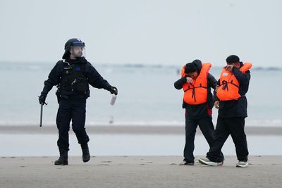French police use pepper spray on migrants trying to cross English Channel