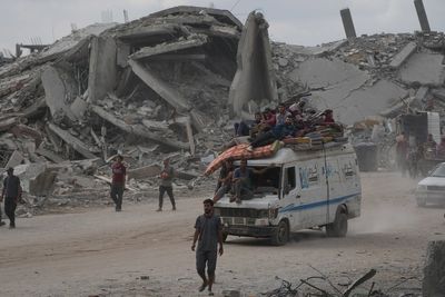 The Latest: Palestinians journey back home as aid convoys start to enter Gaza