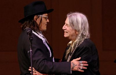 Johnny Depp joins Patti Smith on stage at London Palladium concert