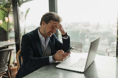 Even workers earning more than $500,000 annually are living paycheck to paycheck—thanks to ‘lifestyle inflation,’ they're continuing to splurge money they don't have