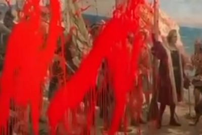Climate activists throw red paint over 133-year-old Christopher Columbus painting in Madrid