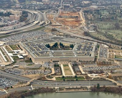 Former Bush adviser charged with amassing top secret files