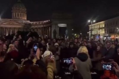 Hundreds gather for rare anti-Putin demonstration in St Petersburg singing protest songs: ‘The old man clings to his throne’