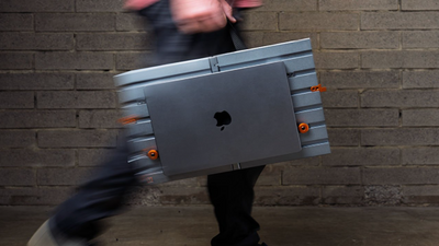 Someone designed an open portable desk with a canvas handle to carry your $10,000 Apple MacBook Pro laptop around - but somehow I don't think it's a very good idea