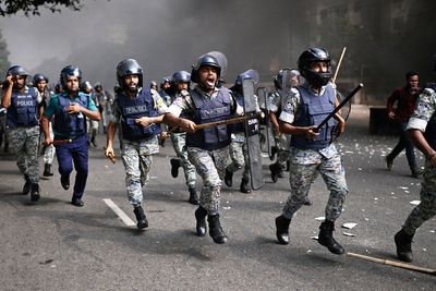 Clashes break out in Bangladesh capital as major political parties sign a new charter