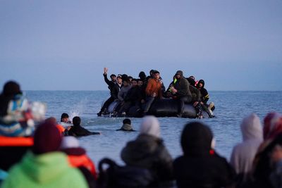Sixteen migrants are deported to France - but hundreds more cross the Channel in small boats