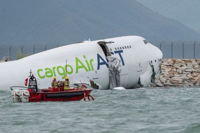 Two dead after Hong Kong cargo plane skids off runway into sea