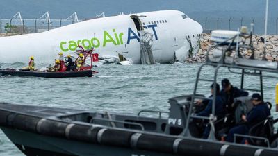 Two killed as cargo plane skids off runway and crashes into sea at Hong Kong airport