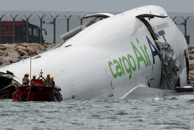 Hong Kong plane crash: Two dead as cargo plane skids off runway and crashes into security vehicle