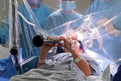Woman plays clarinet during surgery for Parkinson’s – and sees instant results