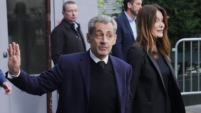 Which highly symbolic books has Nicolas Sarkozy taken to prison?