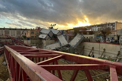 One dead and 10 injured after ‘mini-tornado’ topples three cranes in Paris suburb
