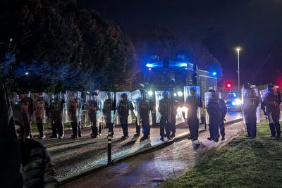 Irish police attacked with bottles as violence flares outside Dublin asylum hotel after alleged sexual assault