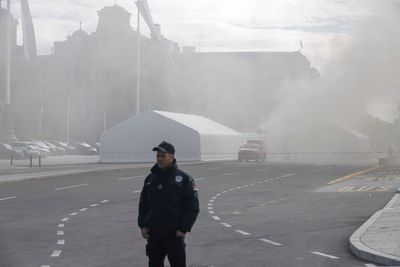 Fire and shooting at a camp in Belgrade hosting the president's loyalists injures 1