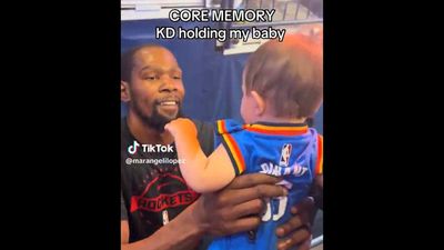 Kevin Durant Holding a Baby Thunder Fan Was Priceless Moment from Rockets Debut