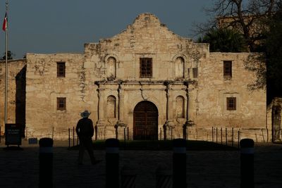 The CEO of the Alamo's historic site has resigned after a top Texas Republican criticized her