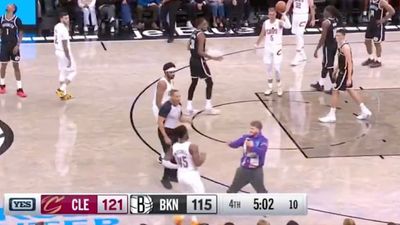 Fan Takes Donovan Mitchell by Surprise by Running onto Court During Cavs-Nets Game