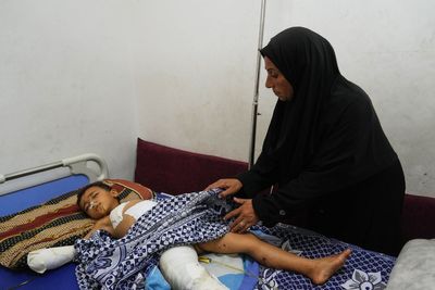 A bomb in Gaza’s rubble badly wounds six-year-old twins who thought it was a toy