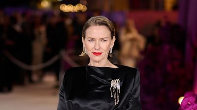 Naomi Watts elevates her silky black dress with a sparkly statement brooch at 'All's Fair' premiere