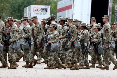 Trump’s move to pay troops amid shutdown sets dangerous precedent, experts warn