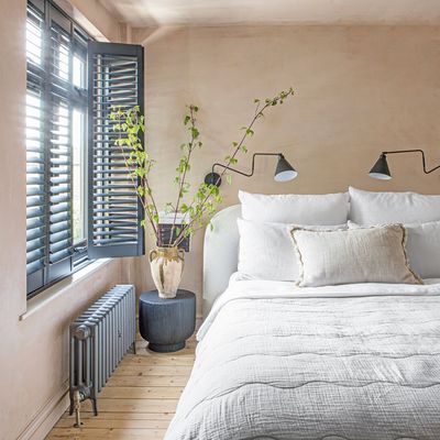 Sorry bedside lamps, there's a new lighting trend in town – experts say it instantly 'makes the bedroom feel less cluttered'