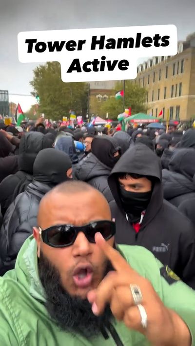 Businessman who was on stage at Tower Hamlets Muslim demonstration calls for peace after Nigel Farage calls protesters 'foreign invading army'