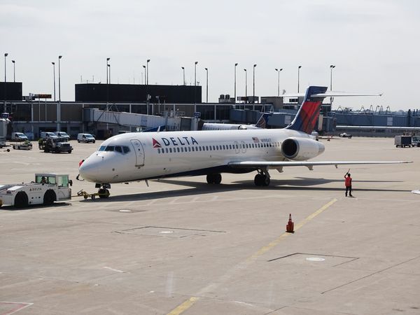 Veteran Delta Flight Attendant Accidentally Deploys Emergency Slide — Causing $70,000 in Damage
