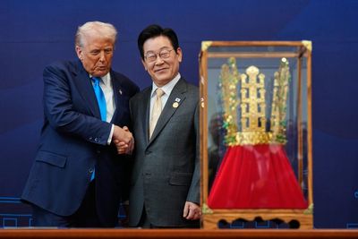 Trump who said he is not a king and denounced the No Kings protests is gifted a gold crown while in Korea
