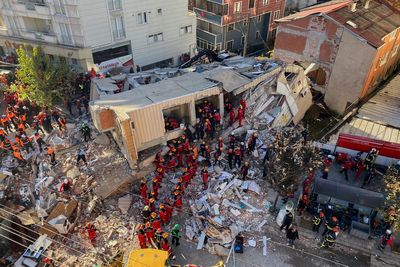 Turkey building collapse kills two as rescuers search for three trapped under rubble