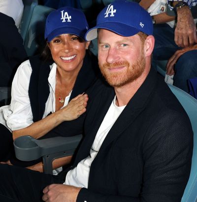 Meghan Markle Styles a Dodgers Cap With Cashmere and Diamonds For Surprise World Series Appearance With Prince Harry