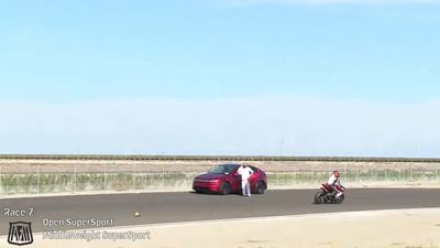 Tesla Drives Onto Live Race Track During Motorcycle Race, as Driver Nearly Kills People