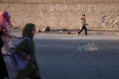 Syrian students return to schools stripped bare by conflict