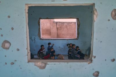 Photos show Syrian students returning to schools stripped bare by conflict