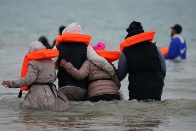 Seventy-five migrants deported to France and 51 allowed into UK under deal