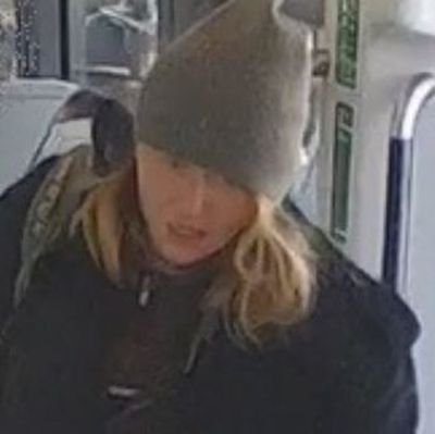 Police hunt woman who pushed man onto tracks at London station