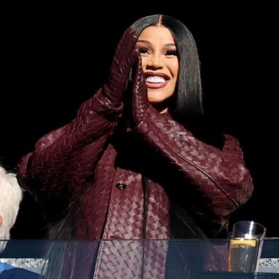 Cardi B Makes Her NFL WAG Debut With a Burgundy Birkin and a Patriots-Inspired Bottega Veneta 'Fit