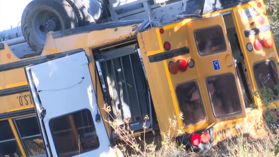 Driver causes school bus full of children to flip onto its roof in horrifying accident. What they did next is even worse