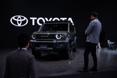 Japan's Toyota, hurt by President Trump's tariffs, reports a drop in profit