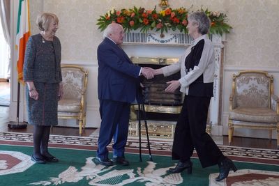 Hugs and handshakes as Ireland’s President welcomes his successor
