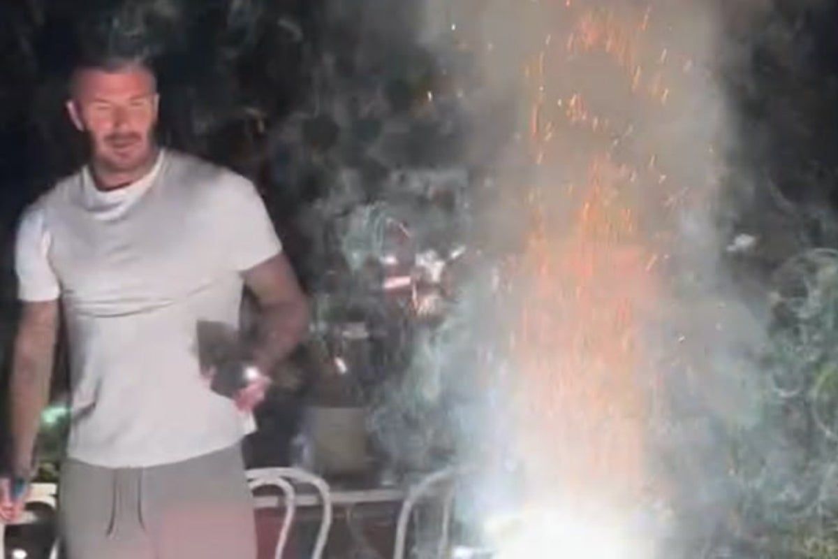 David Beckham runs for cover as firework explodes in…
