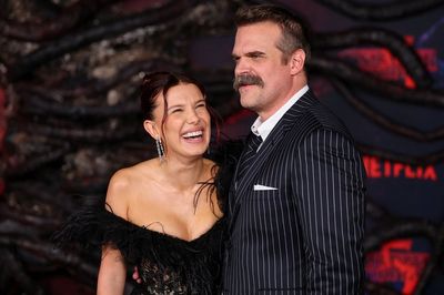 David Harbour and Millie Bobby Brown all smiles at Stranger Things premiere amid 'bullying' claims