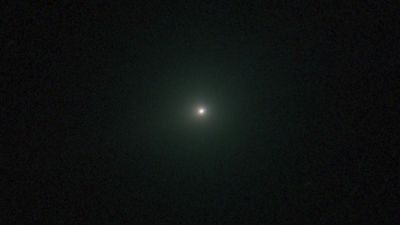 Irradiated Comet 3I/ATLAS glows green and hides its tail in new image