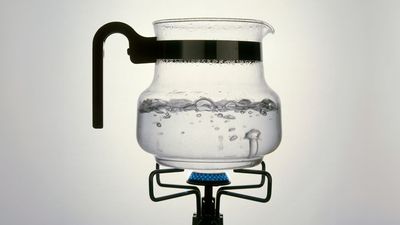 Why does boiling water have bubbles, except in a microwave?