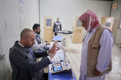 Iraq's displaced Yazidis and security forces cast ballots in early voting in parliament election