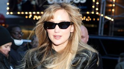 Jennifer Lawrence brings back the divisive Noughties trend of wearing a dress over jeans - and makes it look so good