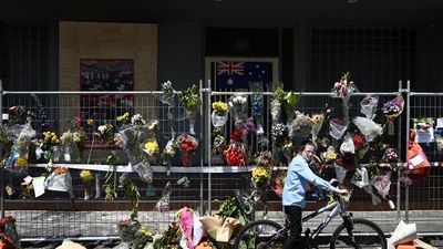 Premier backs down on protester face mask ban