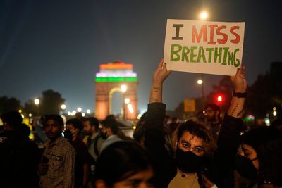 Delhi tightens anti-pollution curbs after citizens take to streets over poor air quality