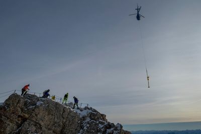 The gilded cross on Germany's highest peak has too many stickers. Now it's being restored
